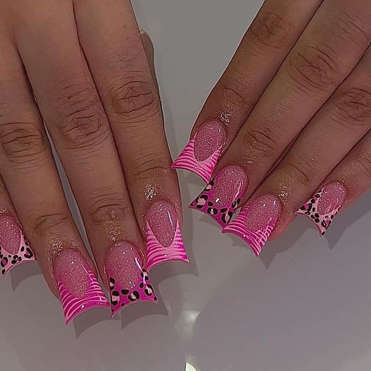 Trendy Vibrant Pink Nail Design with Glossy and Matte Finishes, Playful French Tips, Stripes, and Leopard Print Accents.