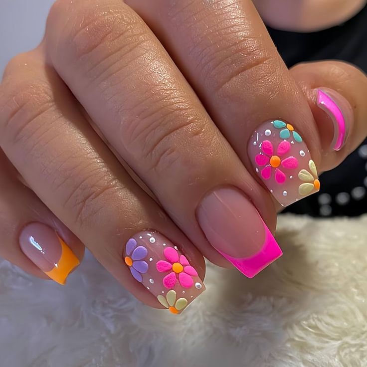 Vibrant Floral Nail Art: A Whimsical Summer Design with Colorful Flowers and Playful Ombre Tips.