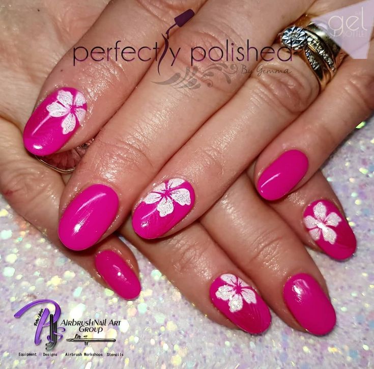 Playful Elegance: Vibrant Pink Nails with Delicate White Floral Accents