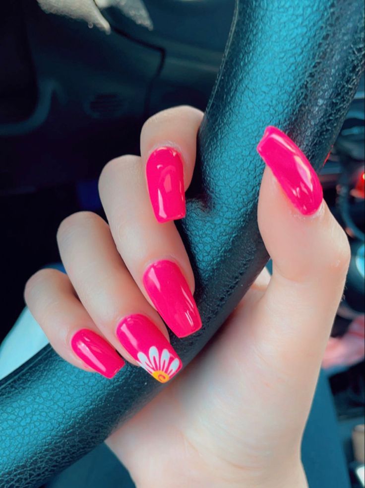 Bold Vibrant Pink Nails with Elegant Floral Accent for Any Occasion