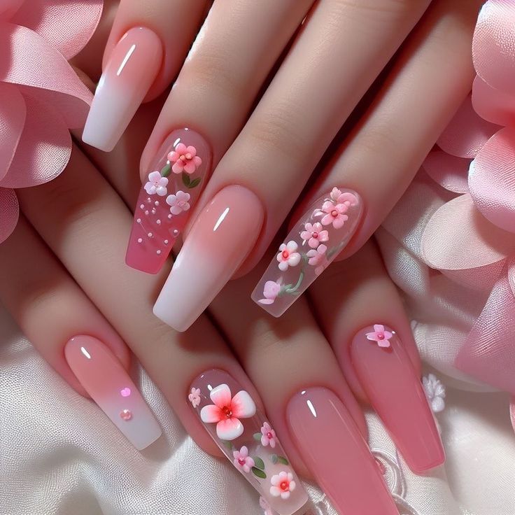 Romantic Floral Nail Design: Soft Pink Ombre with Sparkling Accents.