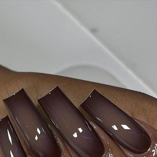 Sophisticated Elegant Brown Nail Design with Chic Gradient Effect and Glossy Finish.