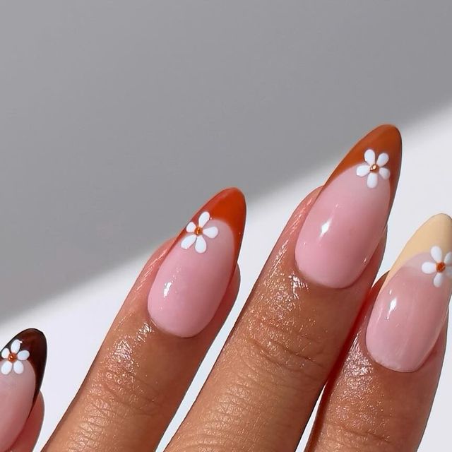 Charming Pastel Floral Nail Design with Unique Tips and Delicate Accents