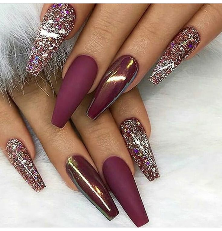 Elegant Deep Burgundy Nail Design with Textures and Glitter Accents.