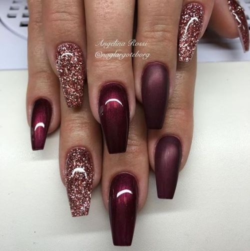 Luxurious Burgundy Nail Design with Sparkly Accents and Elegant Finishes.