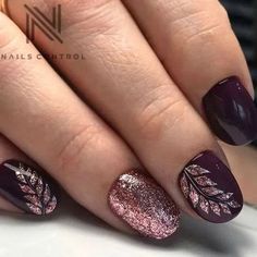 Chic Nail Design: Deep Burgundy with Shimmering Rose Gold and Nature-Inspired Detailing.