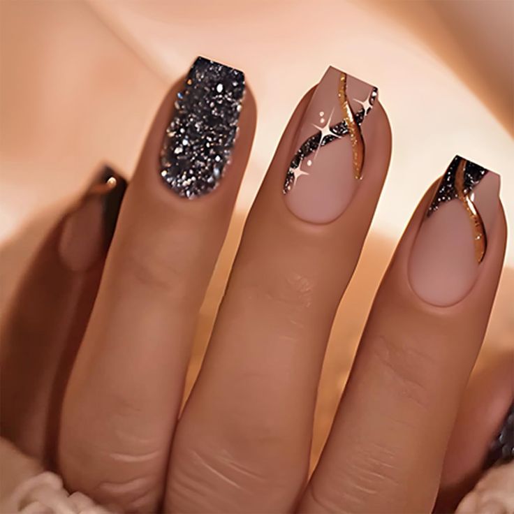 Chic Nail Art: Matte and Glitter Fusion with Gold and Black Accents.