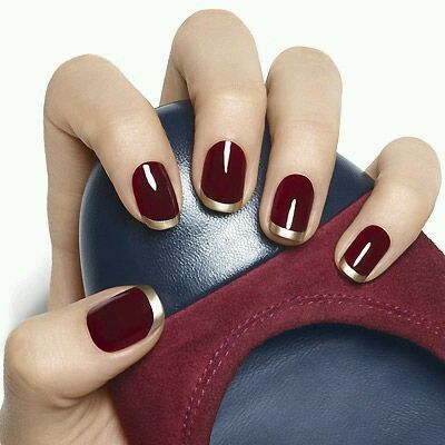 Chic Maroon Nails with Gold French Tips: A Sophisticated and Versatile Design.