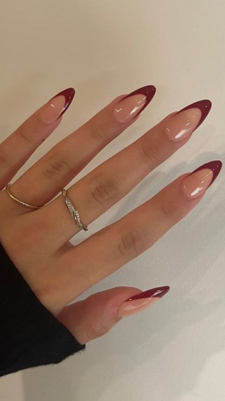 Chic Almond-Shaped Nails with Glossy Nude Base and Burgundy Tips for Understated Elegance.