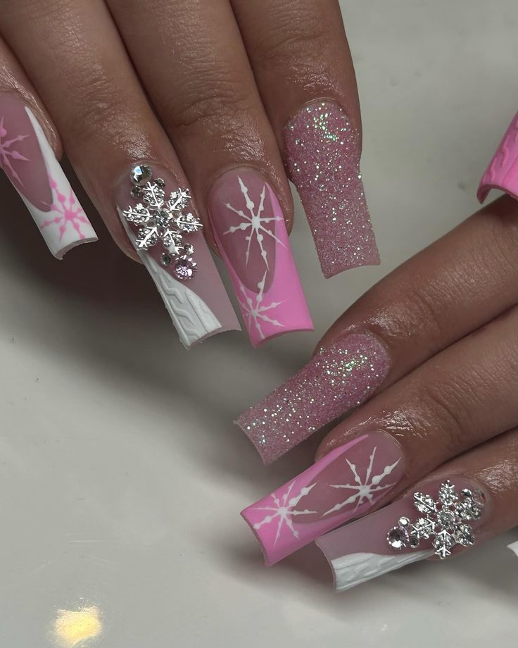 Whimsical Winter Nail Design: Pink Hues and Sparkling Snowflake Accents