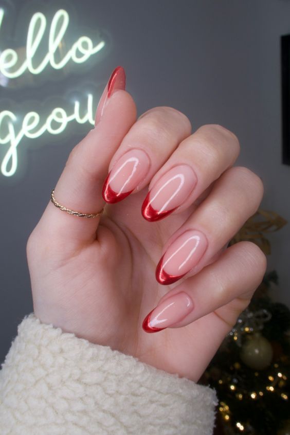 Chic Almond-Shaped Nails: Glossy Nude Base with Vibrant Red Tips