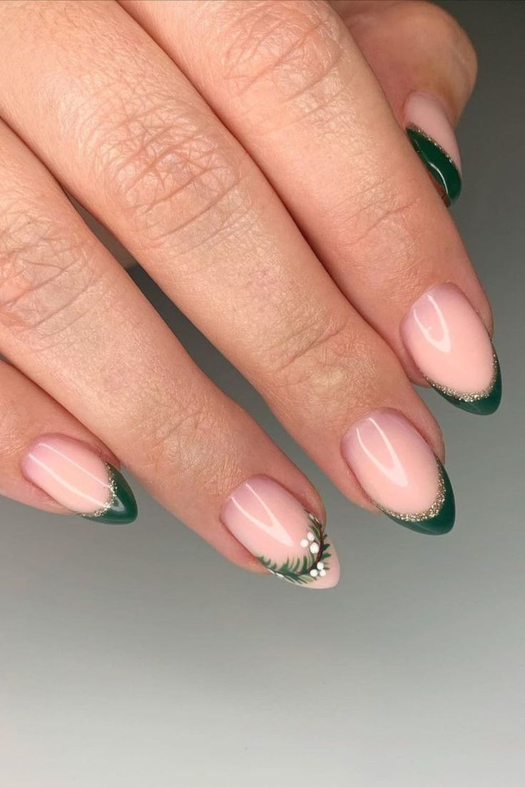 Sophisticated Elegant Nail Design: Soft Nude Base with Dark Green Tips and Floral Accents.