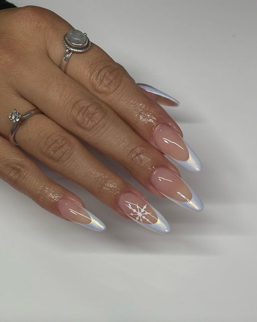 Chic Almond-Shaped Ombre Nails with Snowflake Accent: Perfect Winter Nail Art.