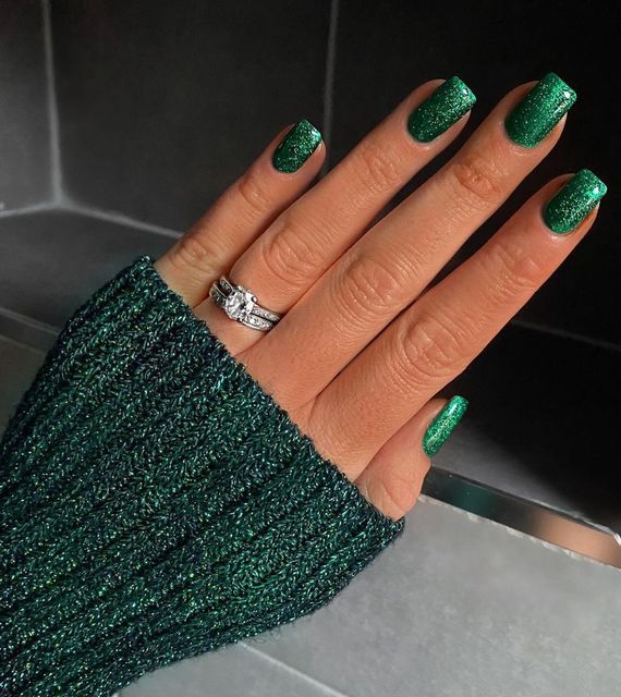 Elegant Sparkling Green Nail Design: A Chic Blend of Glossy and Glittery Accents