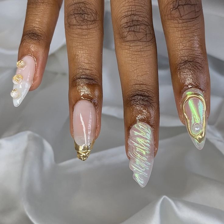 Luxurious Nail Art: Iridescent Finishes, Gold Accents, and Artistic Designs.