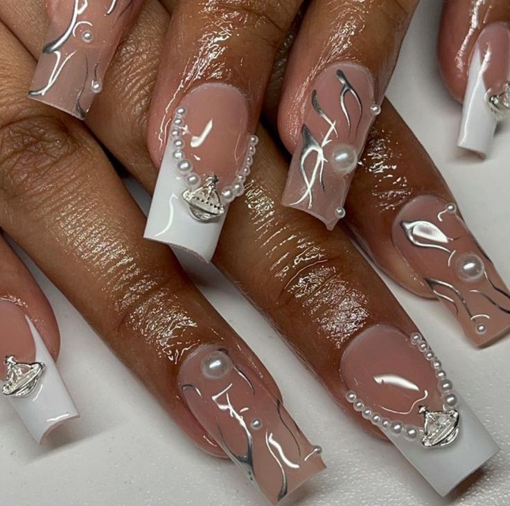 Chic Nude Nail Design with Glossy White Tips and Pearl Accents