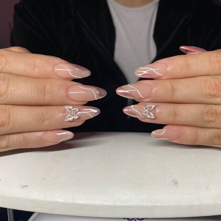 Chic Elegant Nude Nail Design with Glossy Finish and Sparkly Accent Nails.