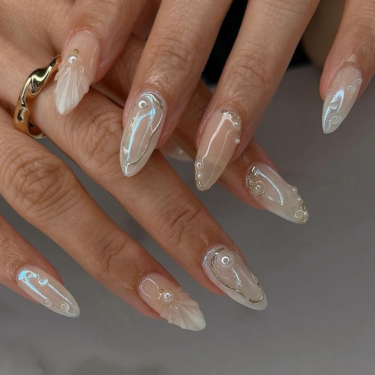 Sophisticated Elegance: Nude and Translucent Long Nails with Iridescent Accents and Pearl Embellishments