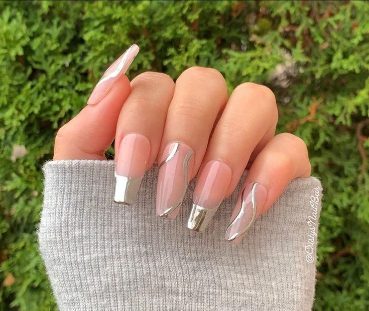 Chic Nail Design with Soft Nude Base and Striking Metallic Tips