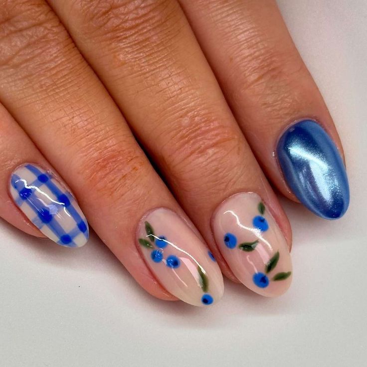 Charming Spring/Summer Floral Nail Design with Light Blue Flowers and Green Leaves