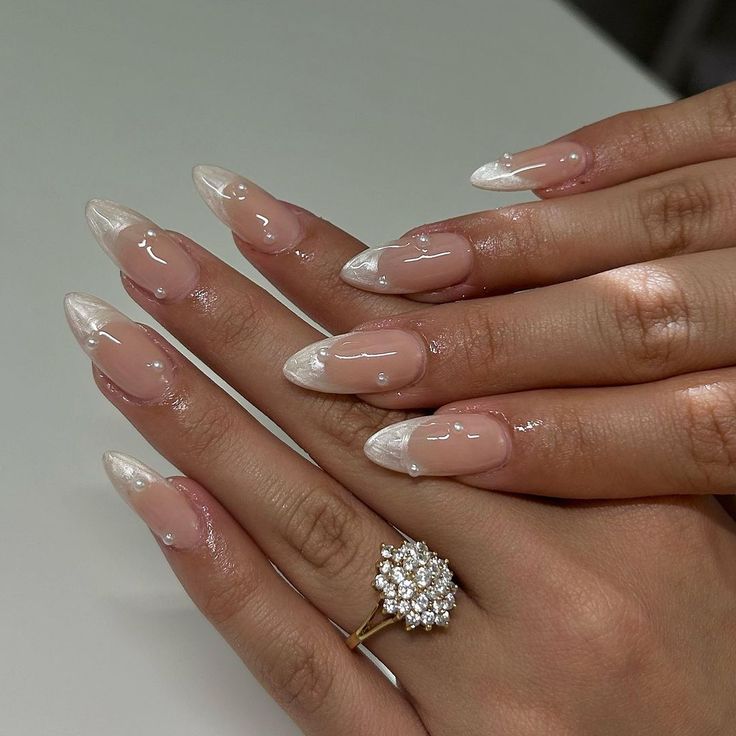 Chic Almond-Shaped Nails with Glossy White Tips and Sparkling Statement Ring.