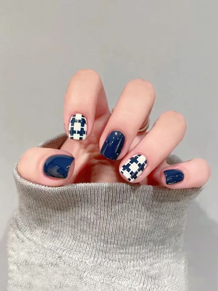 Sophisticated Navy Blue Nail Design with Playful Geometric Pattern.