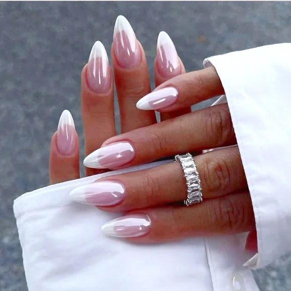 Sophisticated Ombre Almond-Shaped Nails: A Chic Transition from Nude to White.