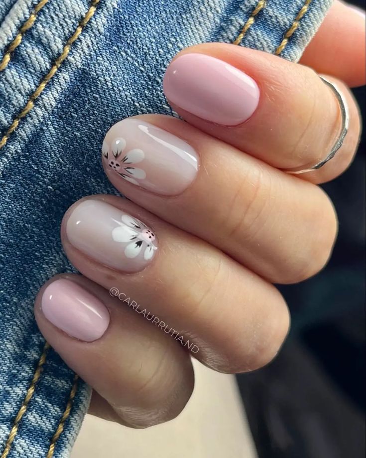 Elegant Floral Nail Design with Soft Pink Hues and Glossy Finish.