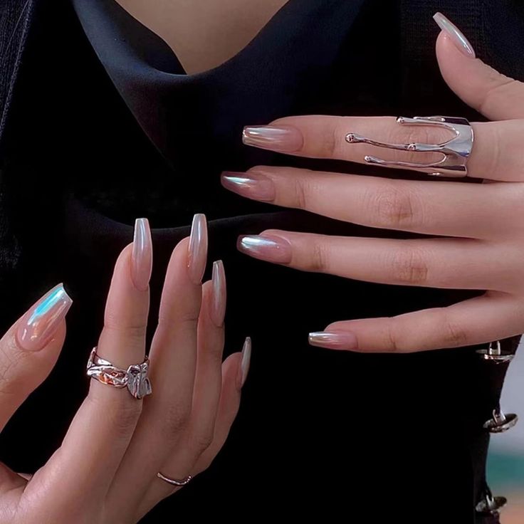 Sublime Iridescent Nails with Sophisticated Ring Accents for Any Occasion.