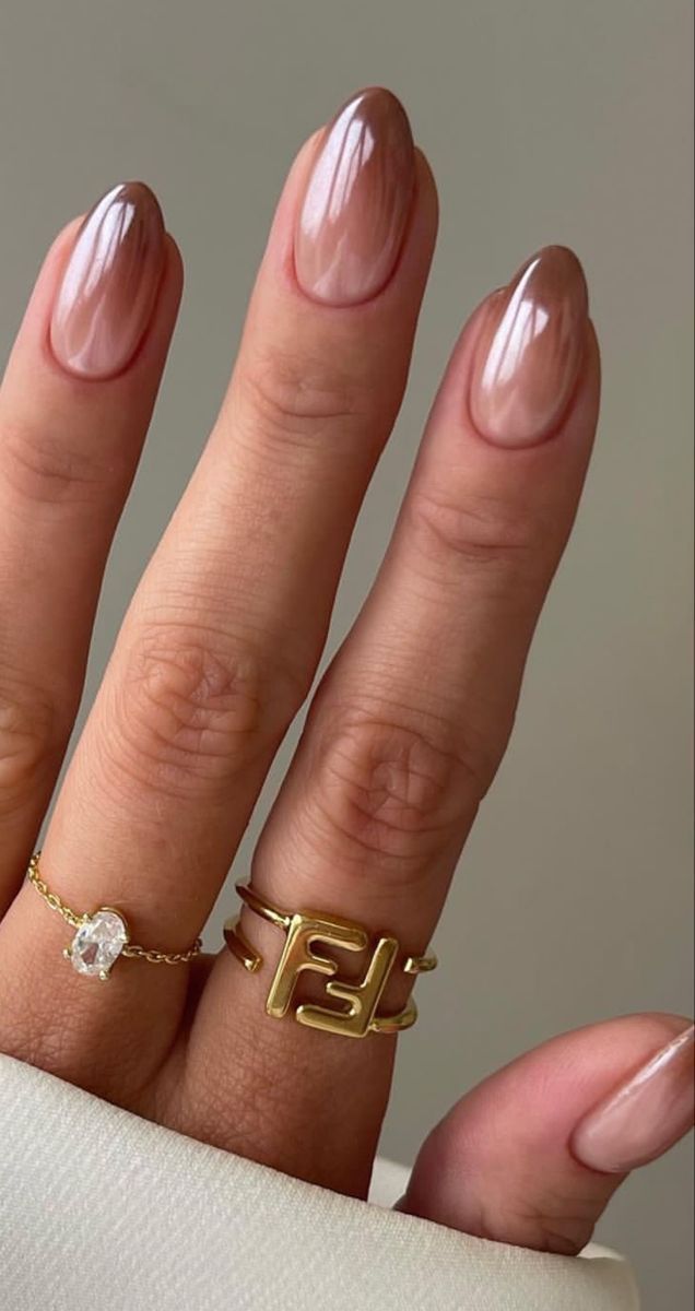 Chic Almond-Shaped Nude Nail Design with Elegant Gradient and Gold Accents