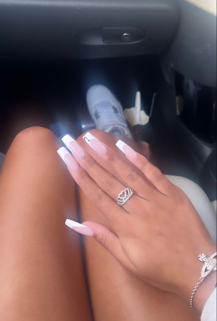 Chic Long Acrylic Nails with Soft Pink and White Tips, Accented by Minimalist Silver Art for a Sophisticated Look.