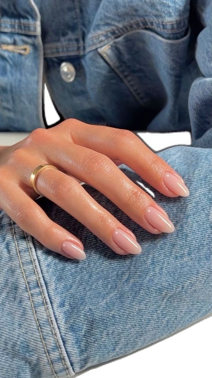 Chic Almond-Shaped Nude and White Tip Nail Design for a Timeless Yet Trendy Aesthetic.