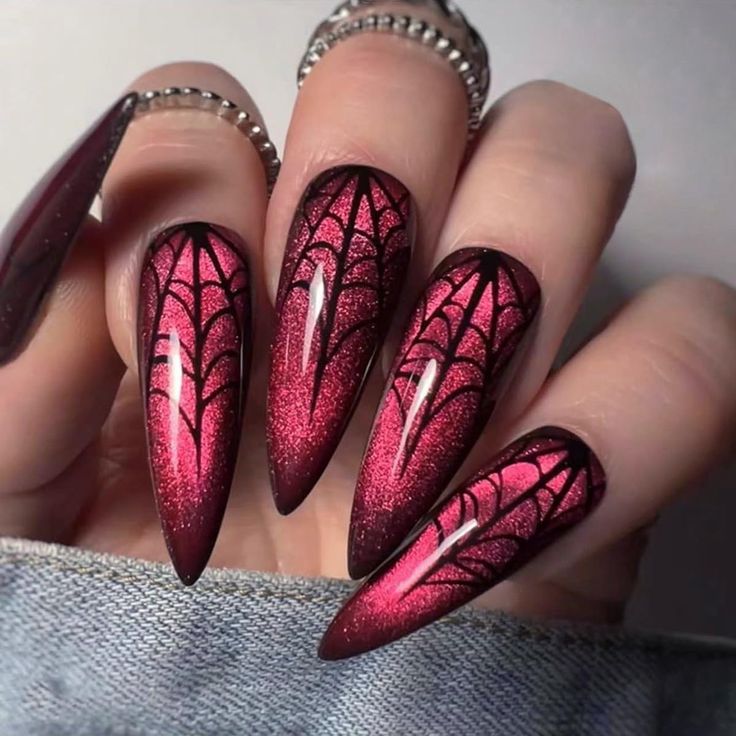 Elegant Gothic Nail Design with Striking Red-Black Gradient and Intricate Spider Web Patterns.