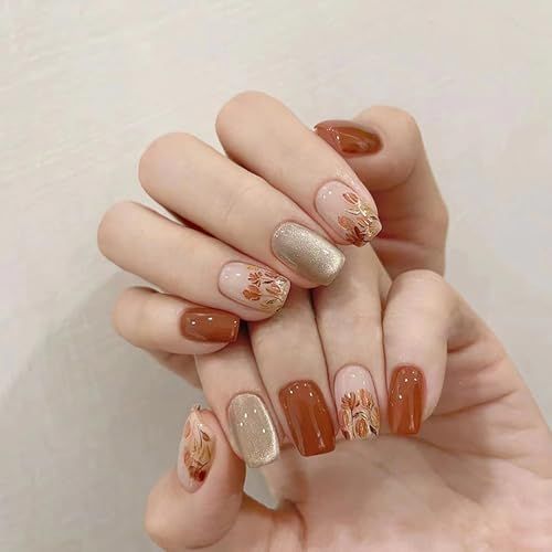 Chic Warm-Toned Manicure: Glossy Brown and Metallic Gold with Floral Patterns