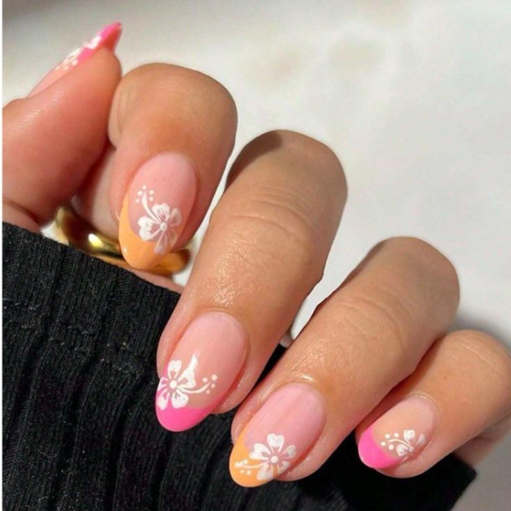 Vibrant Gradient Nail Design with Ombre Effect and Floral Accents.