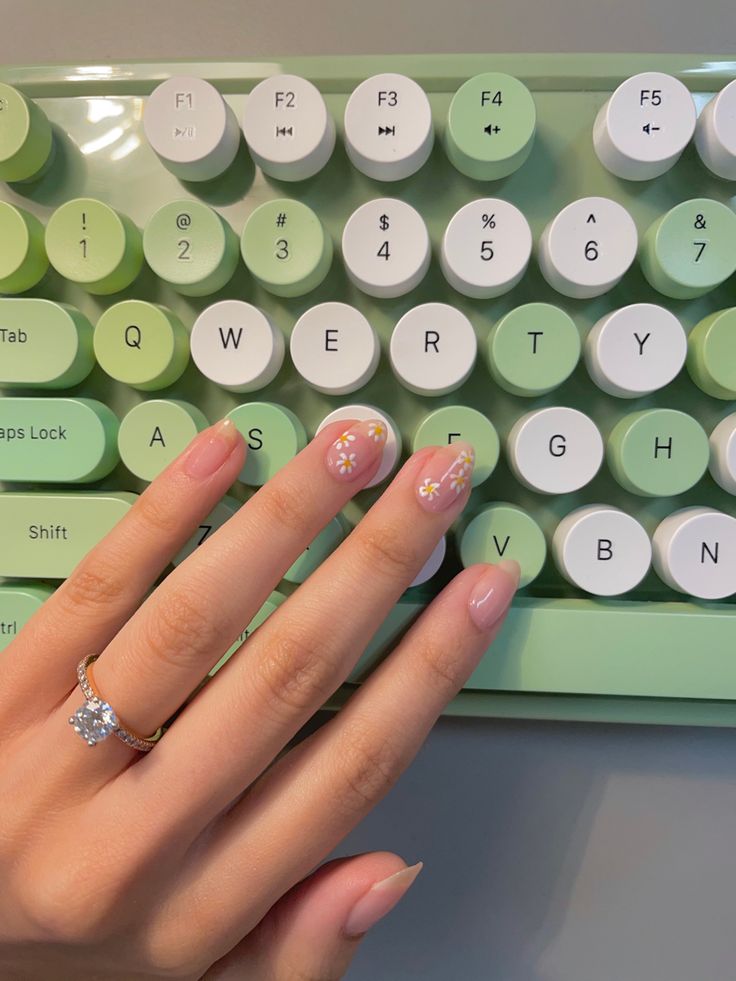 Chic Floral Nail Art in Soft Pink with Modern Minimalist Accents.