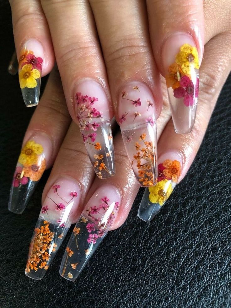 Vibrant Floral Nail Design with Elongated Clear Nails