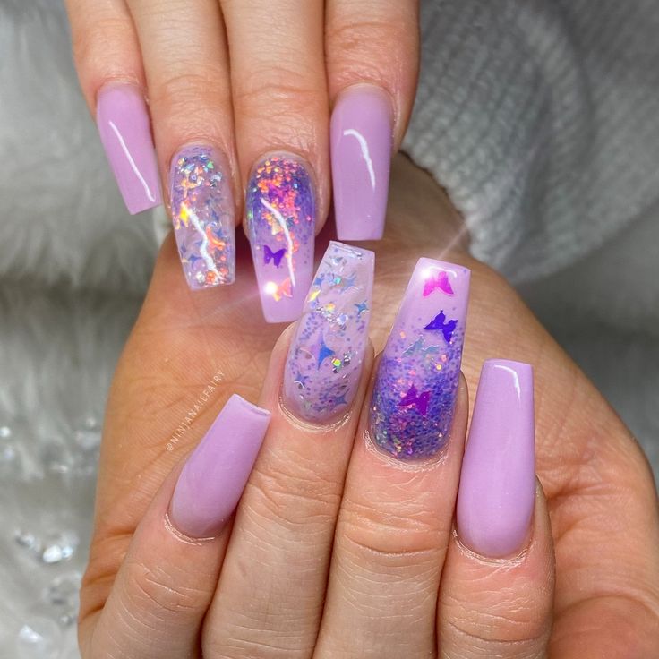 Elegant Lavender-Inspired Nail Design with Glitter, Holographic Flakes, and Butterfly Accents.