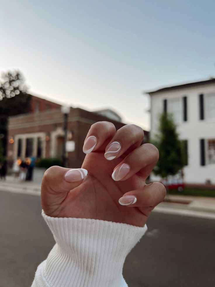 Chic Soft French Manicure with Artistic Design and Translucent Base