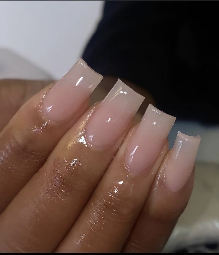 Sophisticated Gradient Nail Design: Soft Pink to Clear Tip for Versatile Elegance.