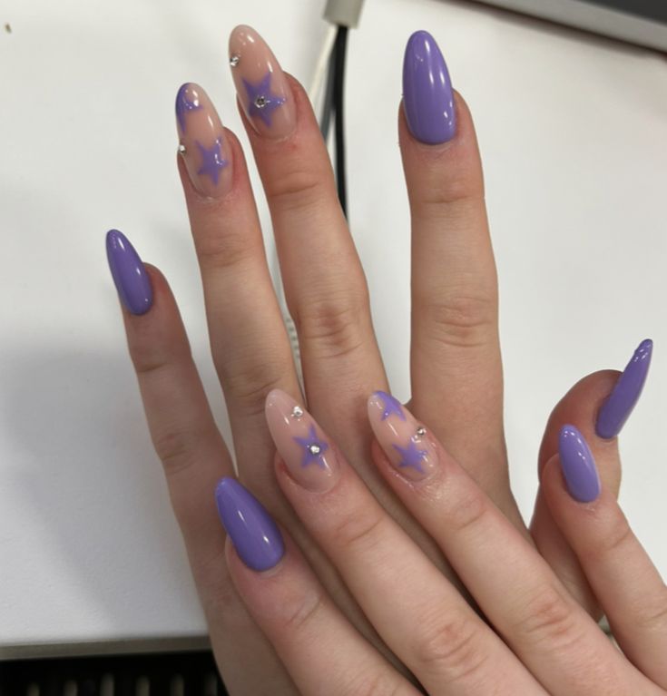 Elegant Lavender and Nude Nail Design with Star Accents for a Whimsical Touch.