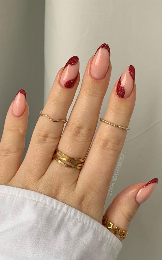 Chic Elegant Nail Design: Soft Pink and Sparkling Burgundy with Gold Accents.