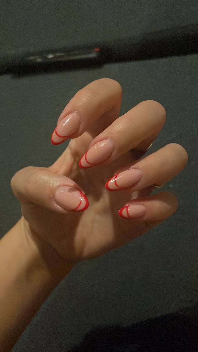 Stylish Nude and Red Tip Nail Design: A Modern Take on the Classic French Manicure.