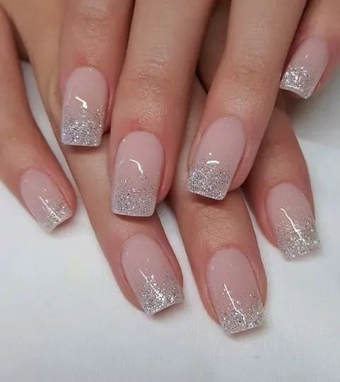 Chic Ombre Nail Design: Soft Pink Base with Glittering Tips