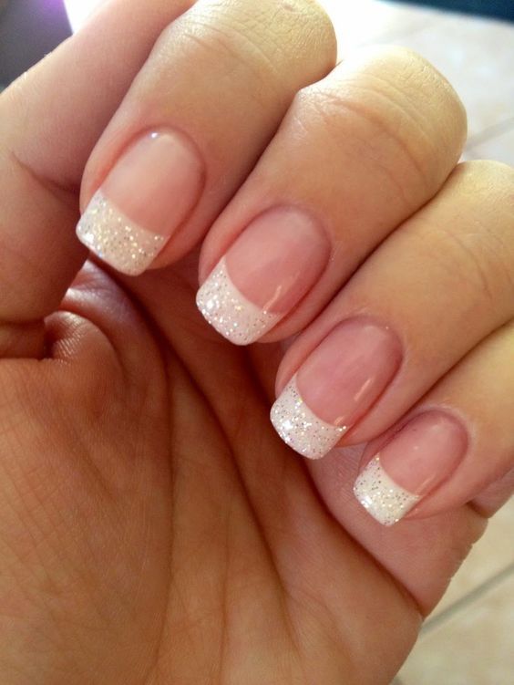 Elegant Nail Design: Sparkling White Tips with Soft Gradient Base for Any Occasion.