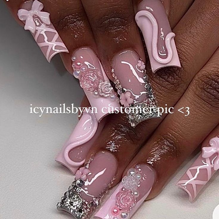 Chic Soft Pink Nail Design with Intricate Embellishments and Glamorous Silver Glitter Tips.