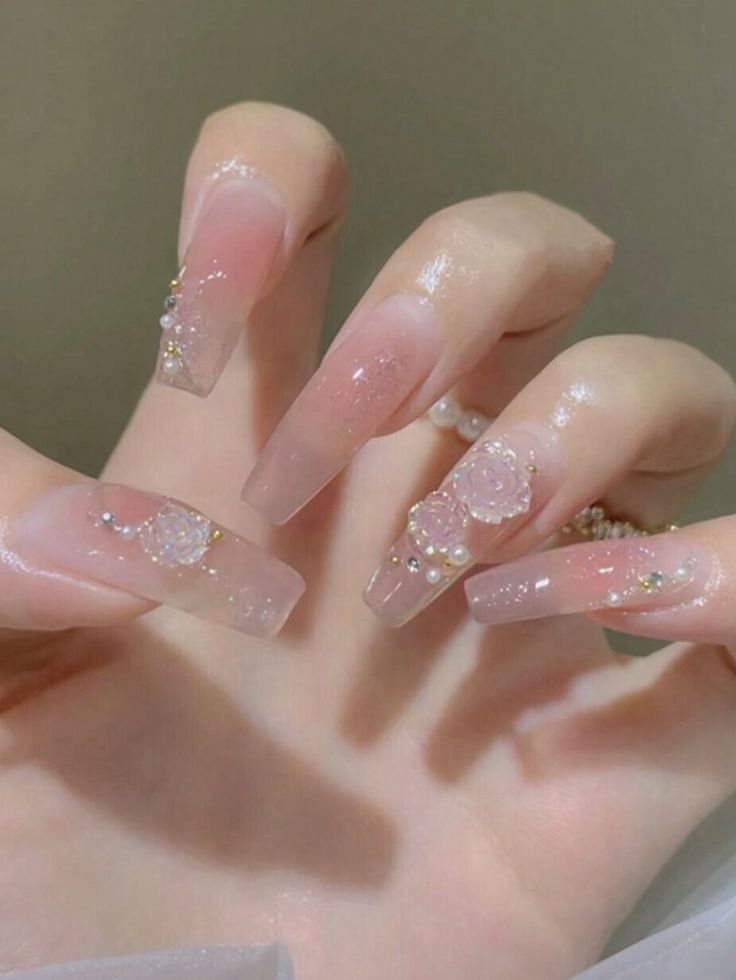 Chic Ombre Nail Design with Pearls and Floral Accents for Sophisticated Elegance.