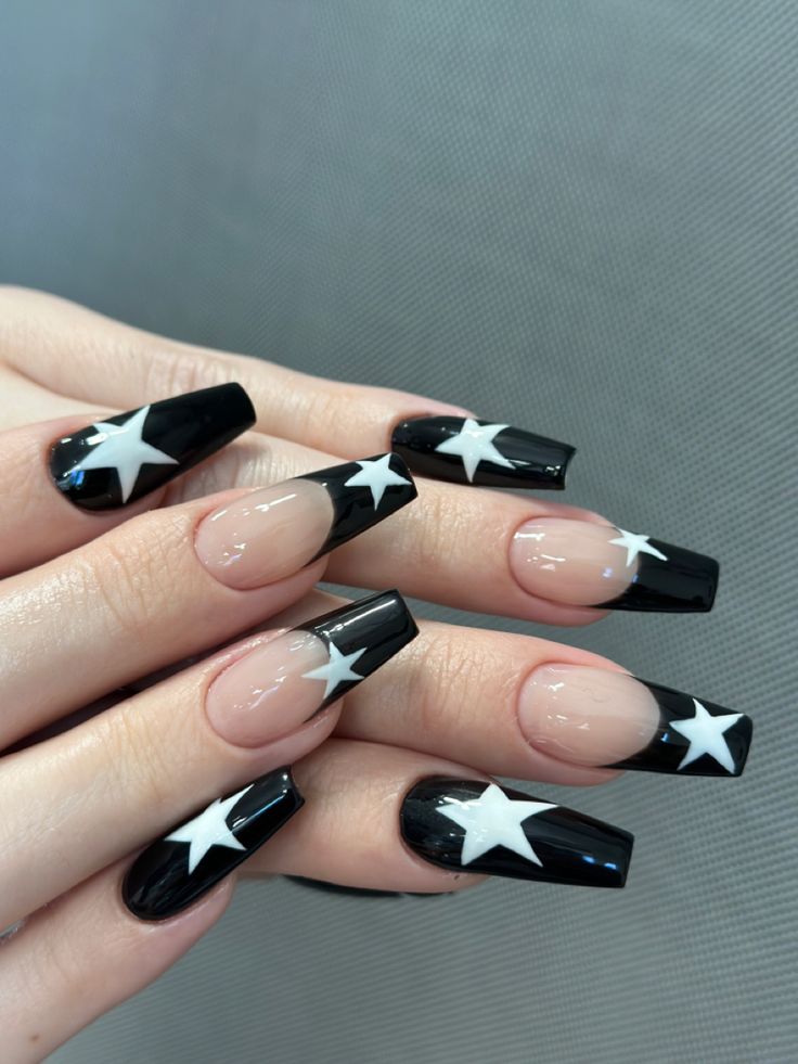 Bold Black and Nude Nail Design with Chic White Star Motif