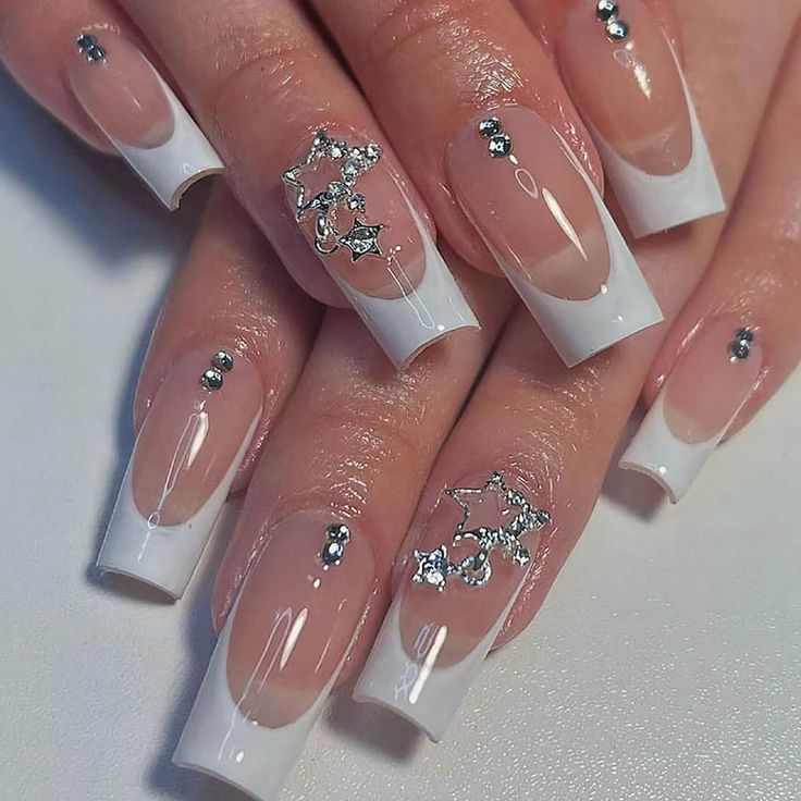 Sophisticated French Tip Acrylic Nails with Rhinestones and Star Motifs