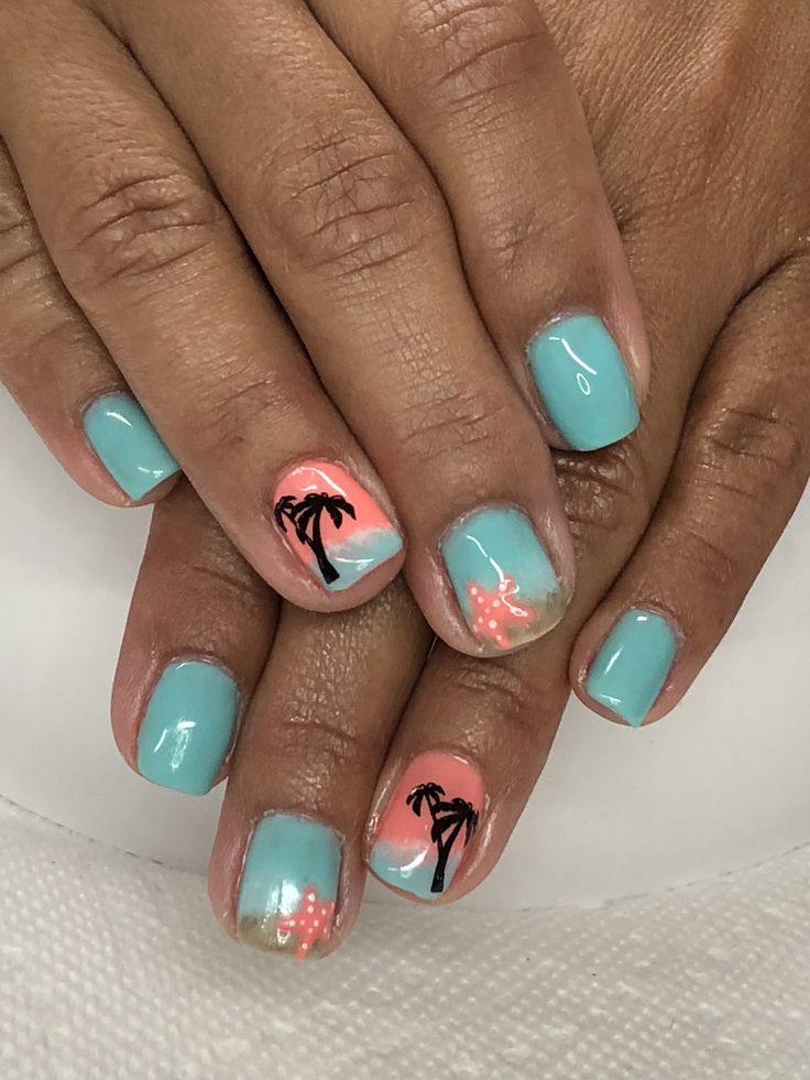 Tropical Teal Nail Design with Coral Accents and Palm Tree Silhouettes for a Fun Summer Aesthetic.